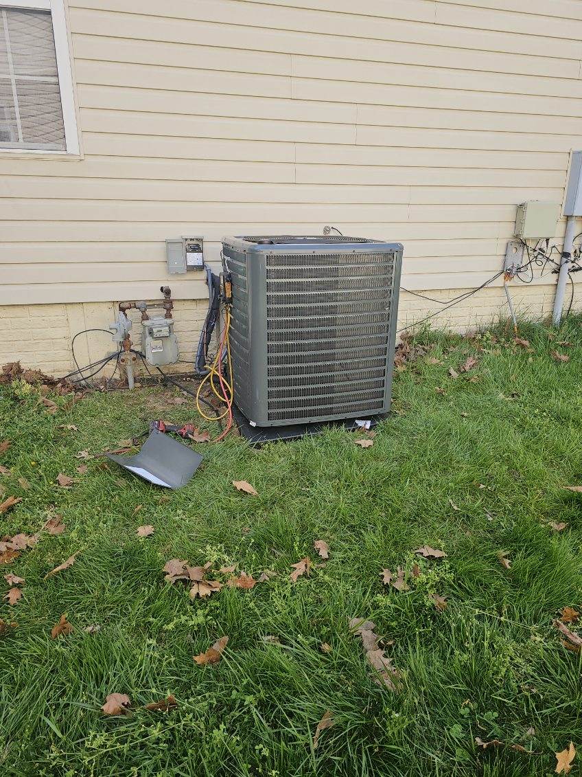 Amen HVAC technician on an outdoor AC repair call in Prince George's County